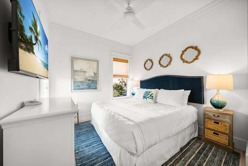 Bedroom #1 features a king bed, with smart TV.