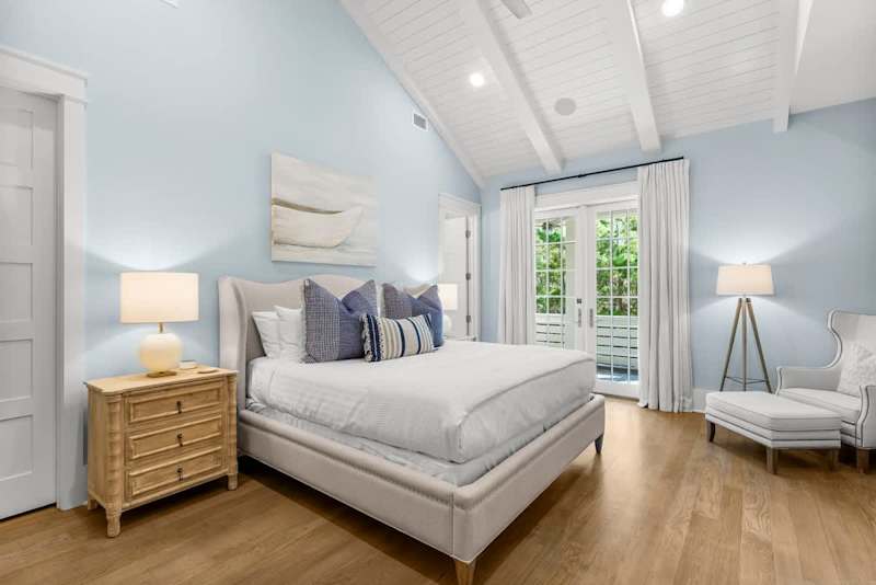 Bedroom #5 features king bed, with ensuite, access to porch, & smart tv.