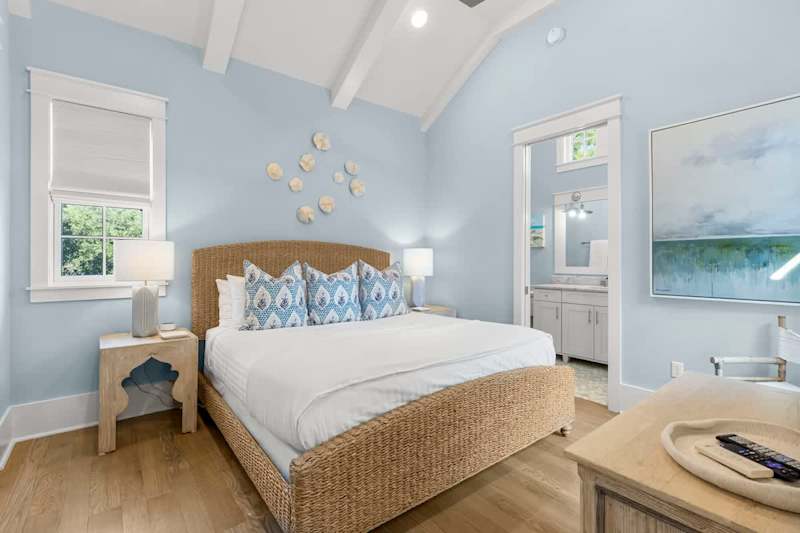 Bedroom #2 features king bed, with ensuite, access to porch, & smart tv.