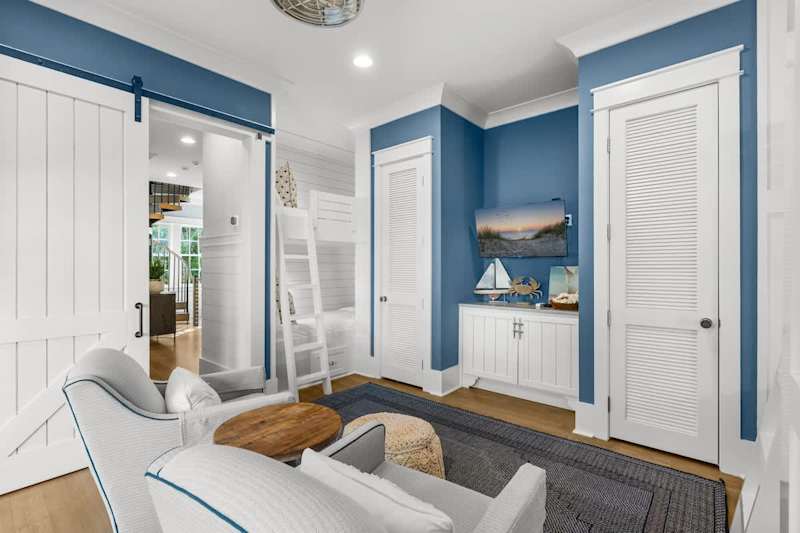 Bedroom #4 features (2) Twin-over-Twin bunks, with access to porch and smart tv.