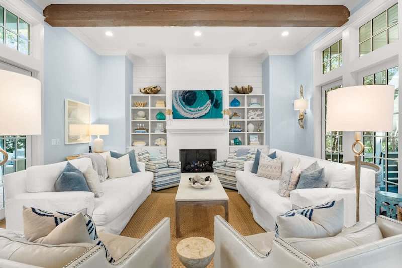 Modern coastal living room with direct access to back patio.