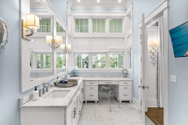 Ensuite bathroom with dual vanities & walk-in shower.