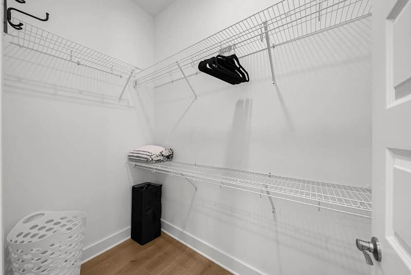 Bedroom features a large walk-in closet.