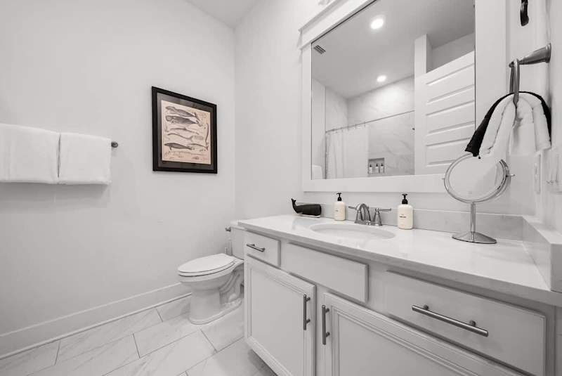 Second floor hallway bathroom features a shower/tub combo.