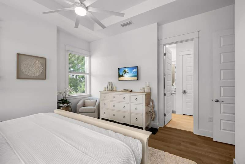 Bedroom #3 features a king bed, ensuite, and smart tv.