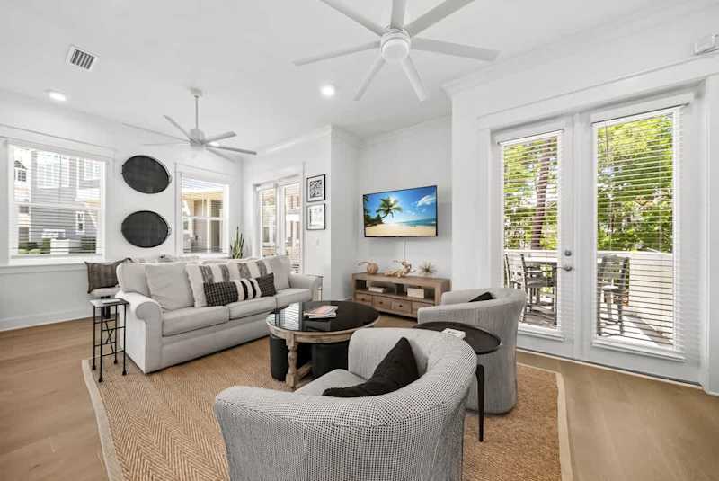 Living room space has a smart tv and plenty of seating for the family!