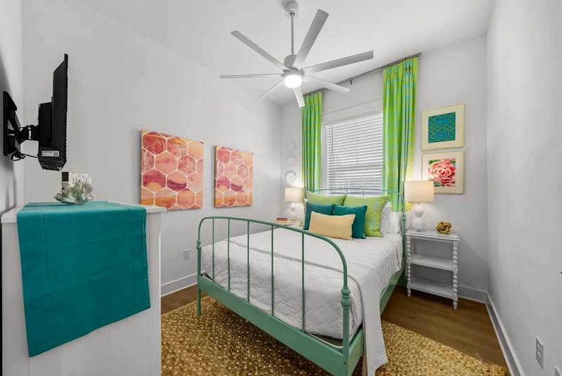 Bedroom #1 features a queen bed and smart tv.