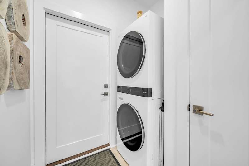 Home features a full sized washer and dryer.