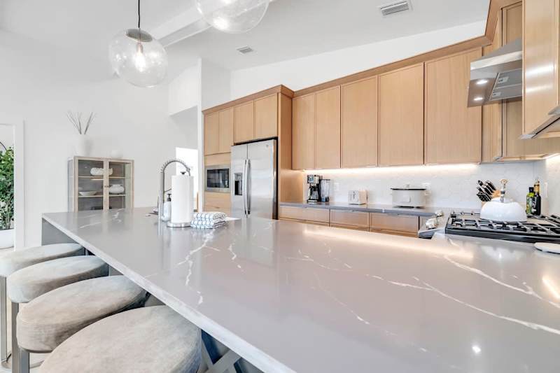 Large kitchen island includes seating for four.