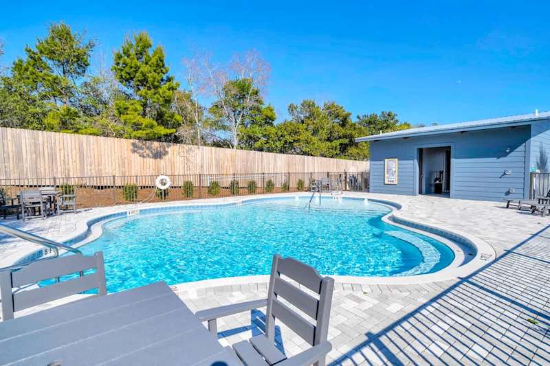 Beautiful community pool with plenty of seating options.