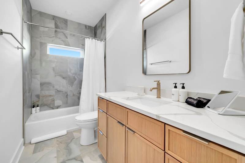 Hall bath features a shower/tub combo.