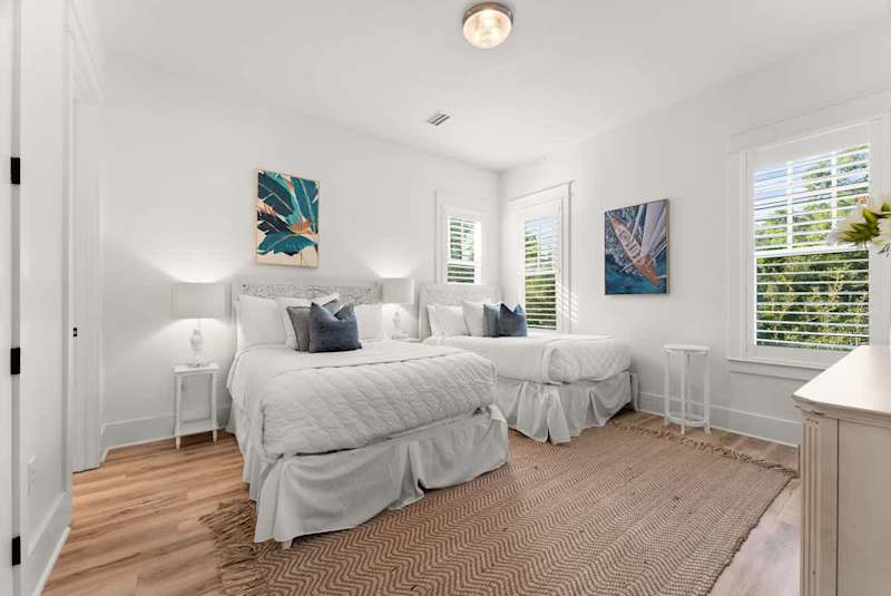 Bedroom #2 features (2) queen beds, with ensuite & smart tv.