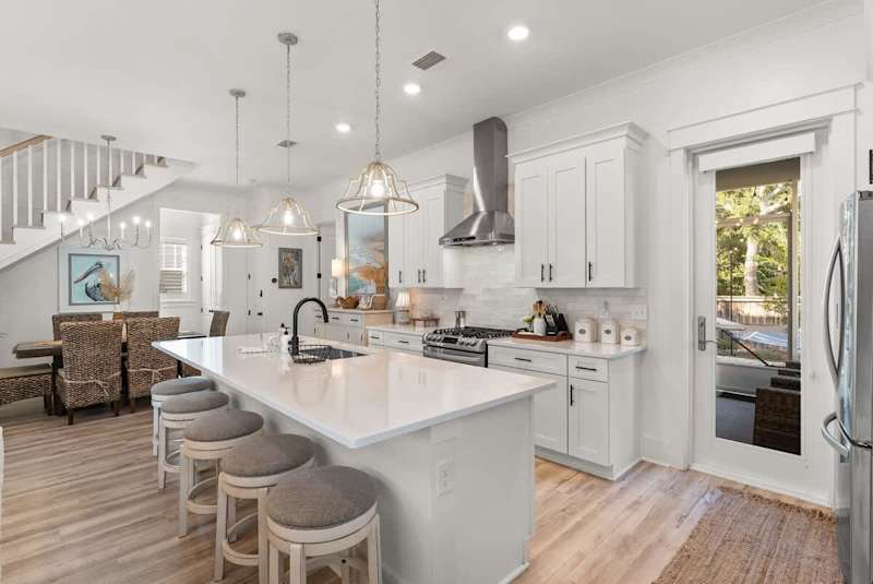 large kitchen island with seating for 5.