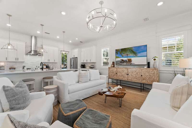 Living room has a smart TV that is perfect for watching movies!
