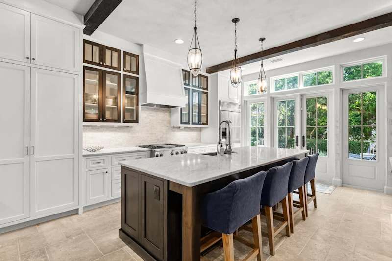 Fully stocked kitchen with island seating for 4. Perfect for preparing family meals!