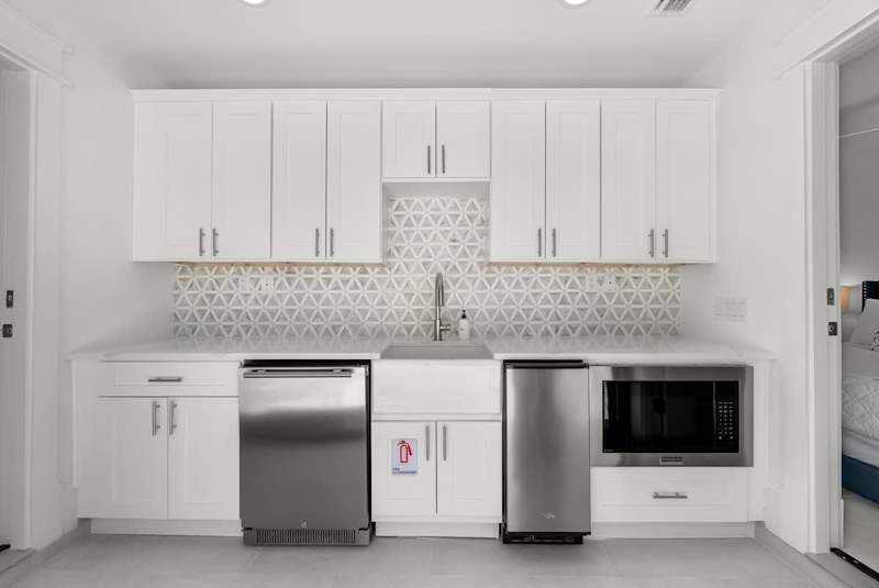 Pool house offers dishwasher, mini fridge, and microwave.