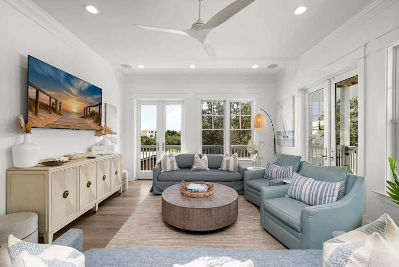 Living room features plenty of seating with a smart tv, perfect for entertaining.