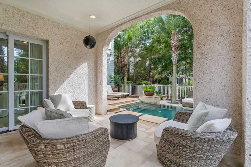 Second outdoor covered patio with seating.