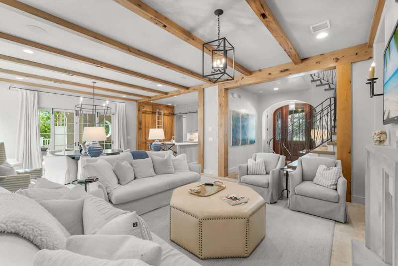 Modern coastal living room with direct access to a screened patio.