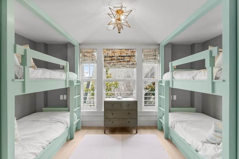 Bedroom #5 features (2) Twin-over-Twin bunks, with ensuite and smart tv.