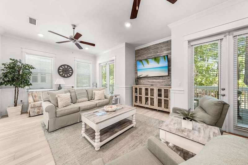 Living room space has a smart tv and plenty of seating for the family!
