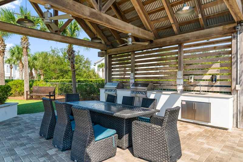Community dining space and gas grills.