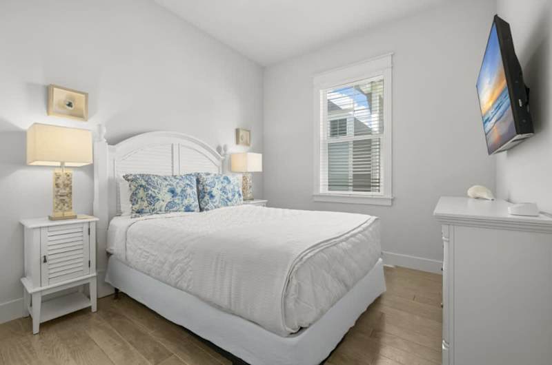 Bedroom #2 features a queen bed and smart tv.