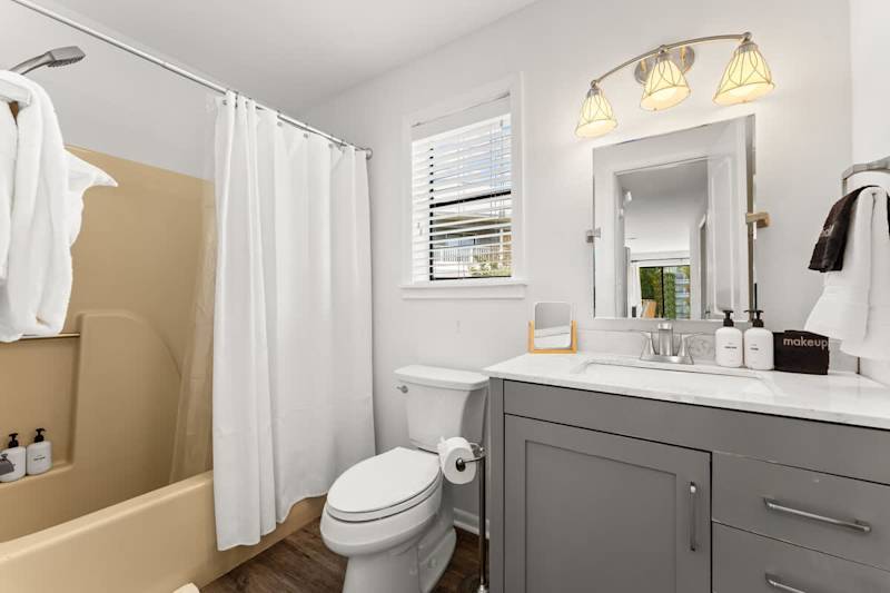 Hall bathroom features a shower/tub combo.
