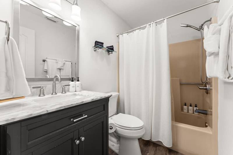 Ensuite bathroom features a shower/tub combo.
