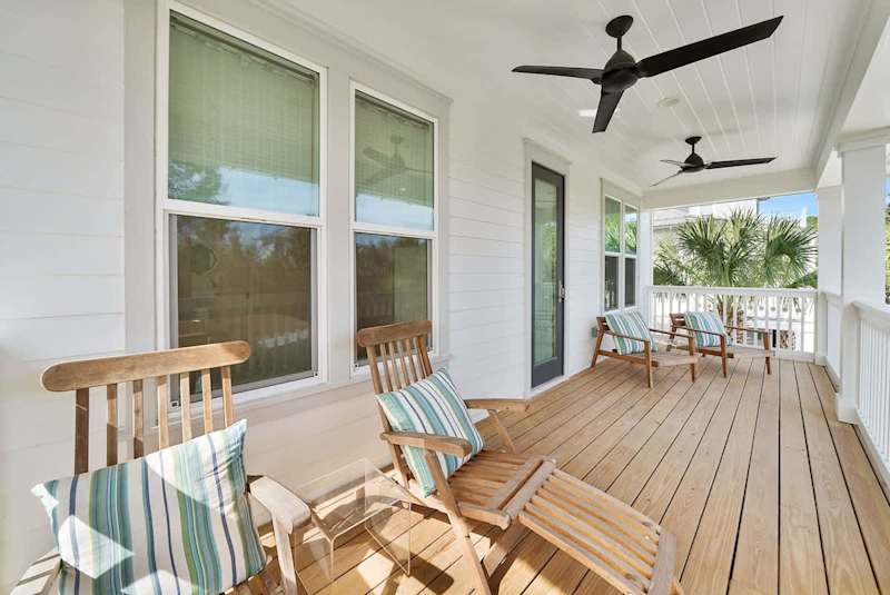 Covered porch with seating off bedroom #4.