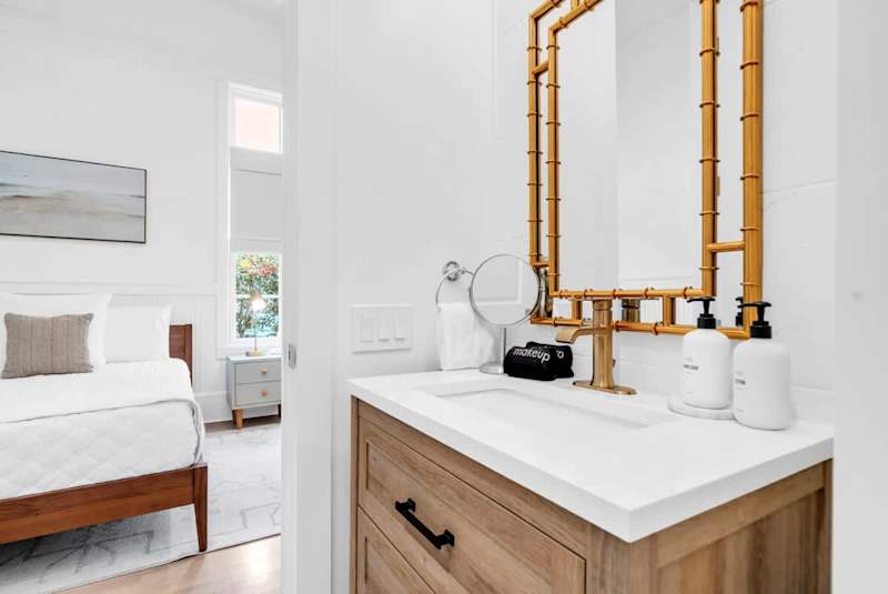 Hall bathroom features walk-in shower & access to bedroom #2.