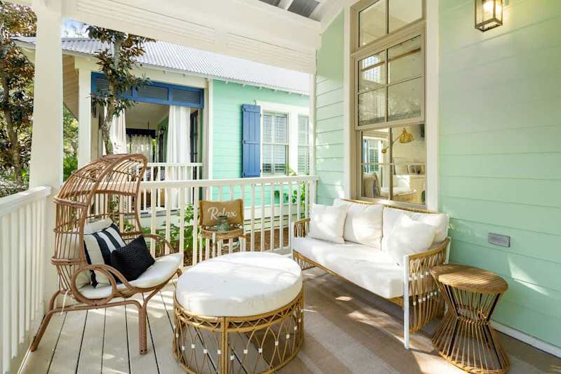 Covered front porch with seating, perfect for morning coffee!