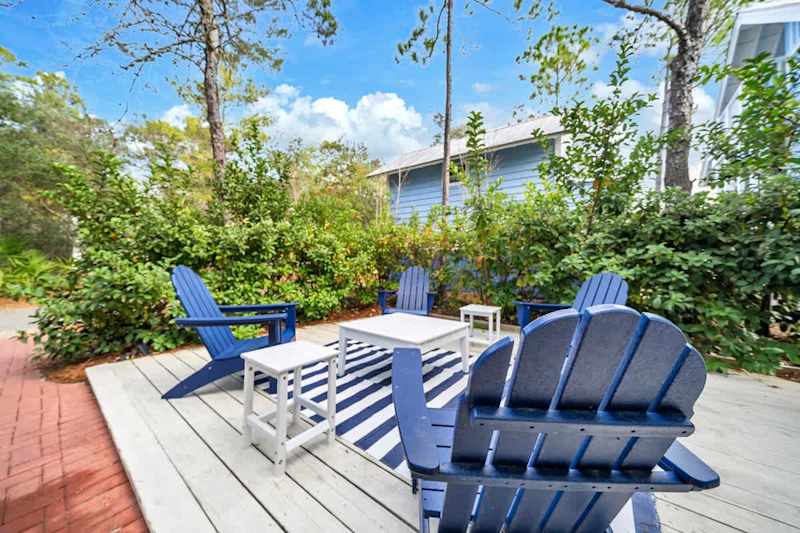 Private backyard features seating & gas grill.