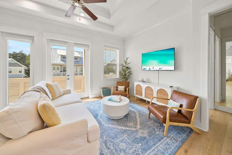 Living room space features a queen sleeper sofa.