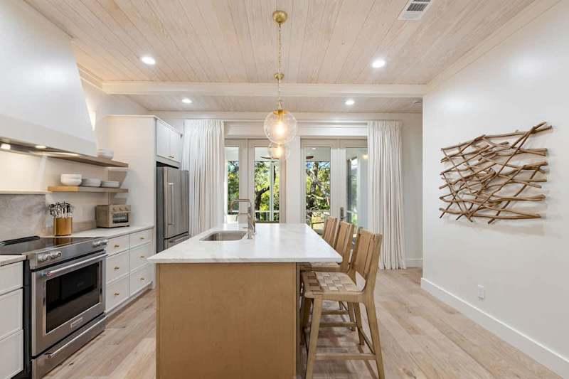 large kitchen island with seating for 3.