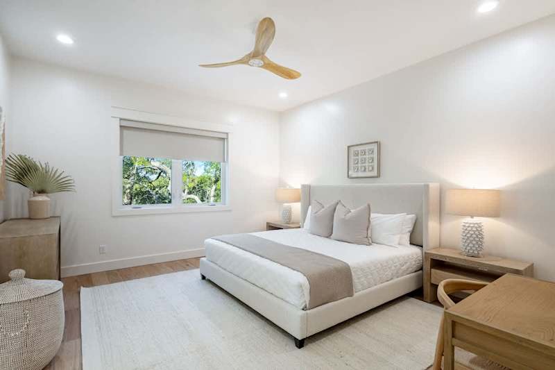 Bedroom #2 features king bed, with ensuite & walk-in closet.