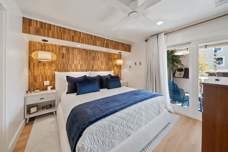 Bedroom #2 features king, with ensuite, smart tv, and access to balcony.