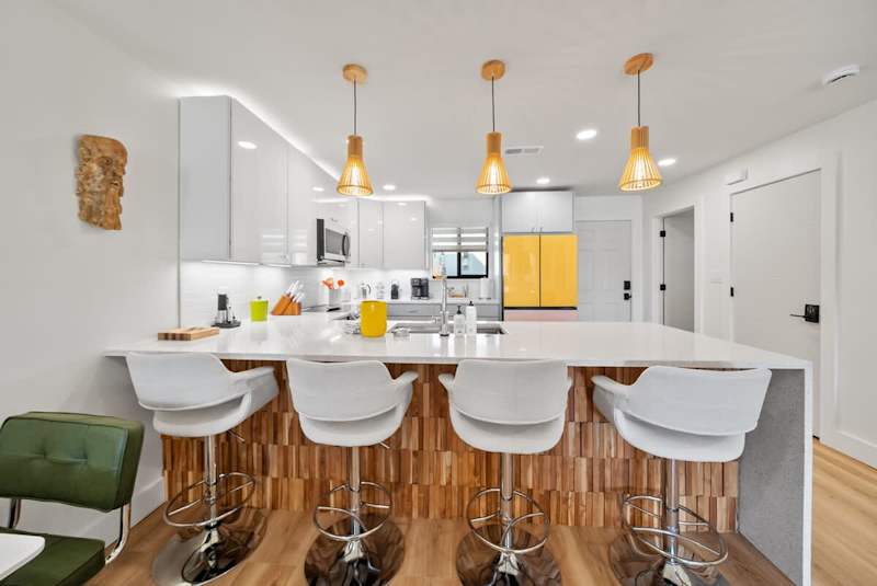 Kitchen island features seating for 4.