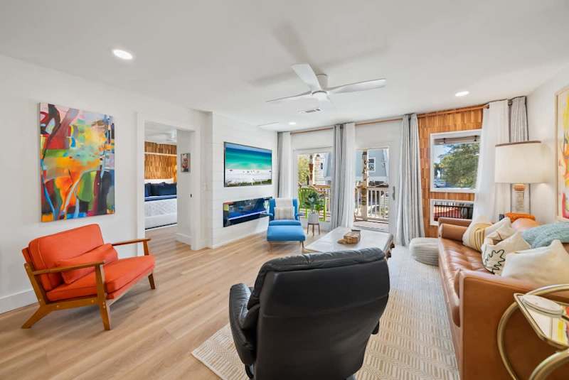 Living room features seating for all along with a smart tv and fireplace.