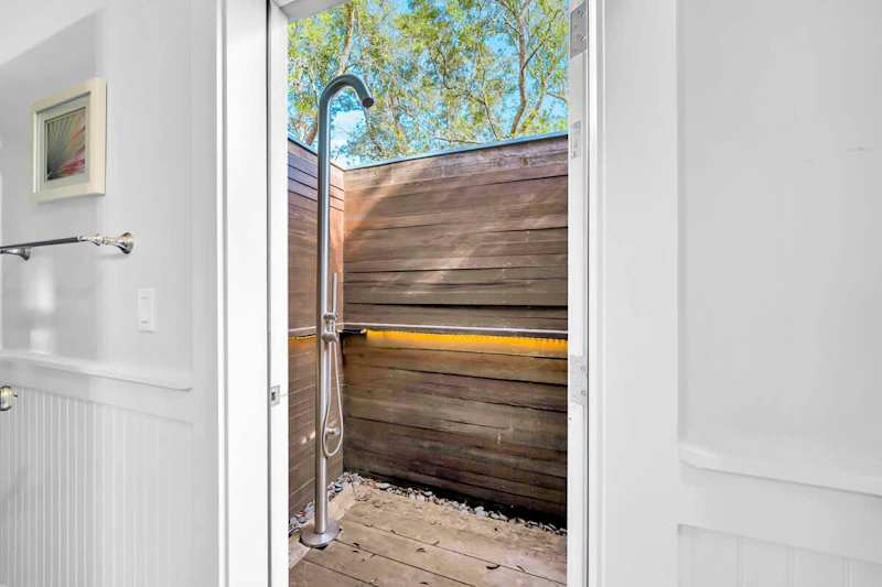 Private outdoor shower off second floor king bedroom bathroom