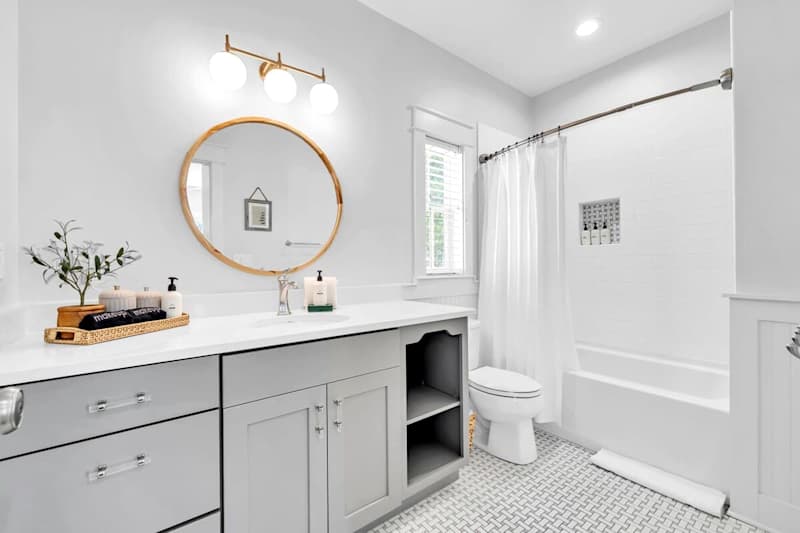 Bunk room ensuite features a shower/tub combo.