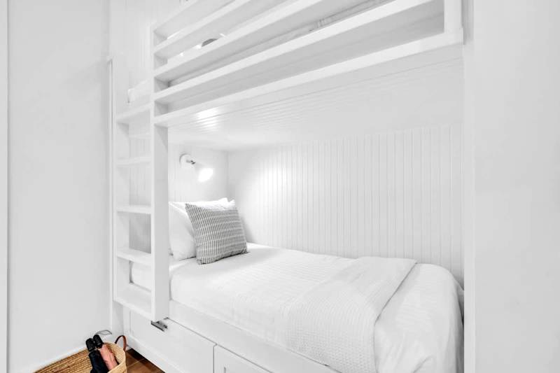 First floor hall features a twin/twin bunk bed.