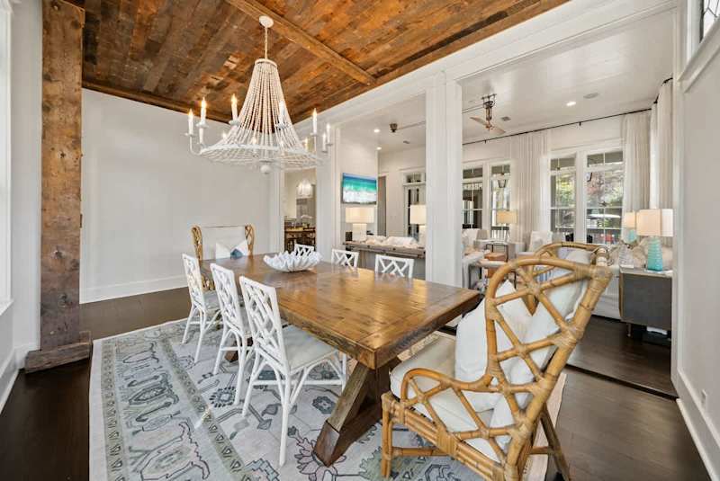 Dining room just off the living room features a large table that includes seating for 8.
