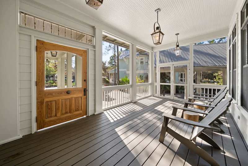 Screened-in front porch is the perfect escape to enjoy your morning coffee.