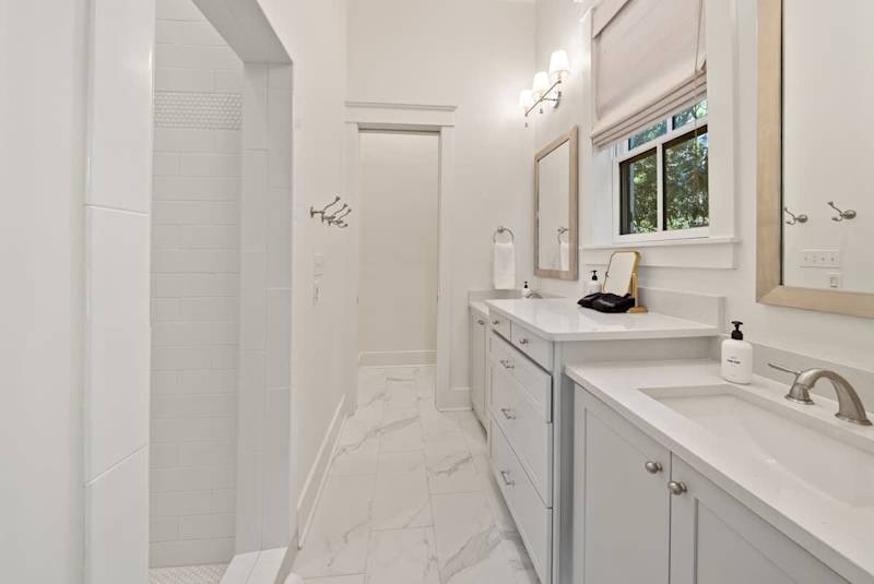 First floor king bedroom ensuite features double vanities and a walk-in shower.