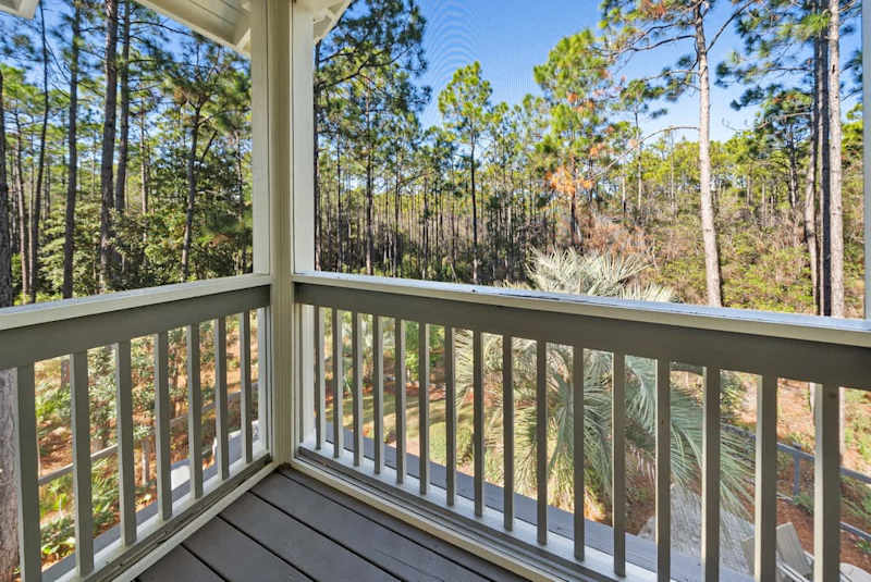 Bedroom also features a screened-in private balcony.