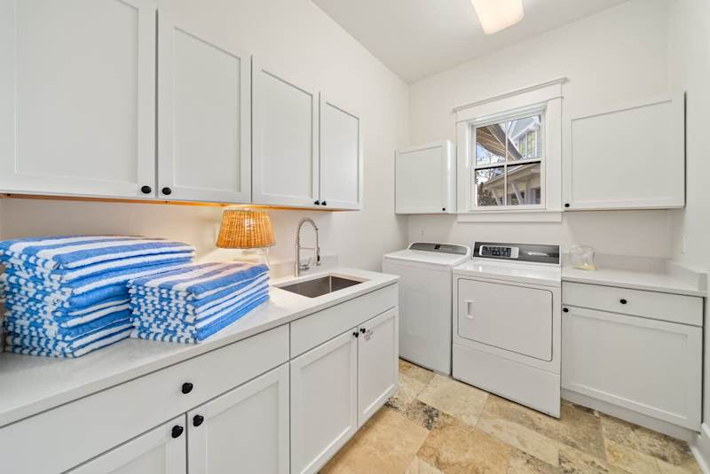 Large laundry room with full sized washer and dryer is located on the second floor.