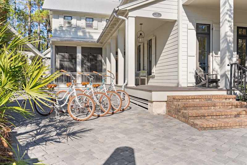 Home includes four adult bikes and three driveway parking spaces.