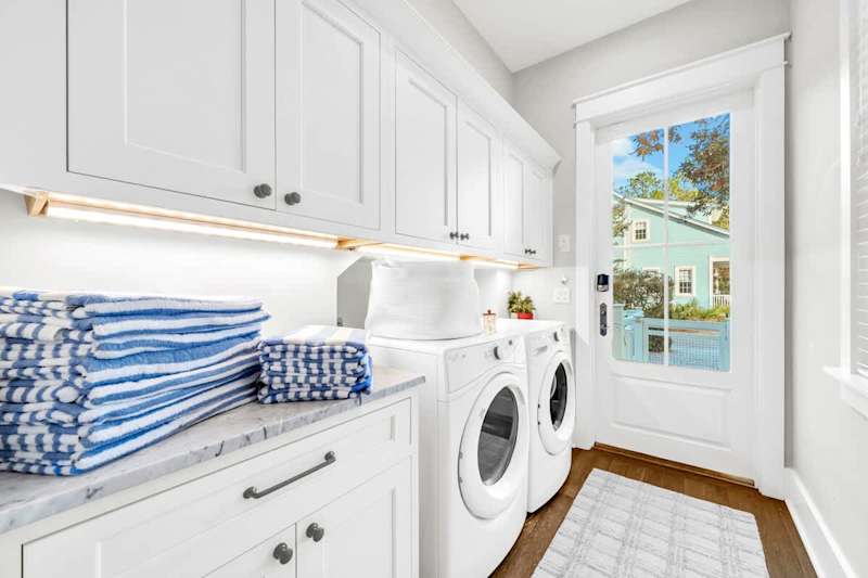 Laundry room leads out to back patio.