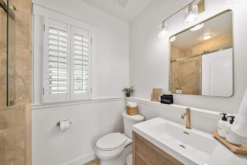 Second floor hall bath features a shower/tub combo.
